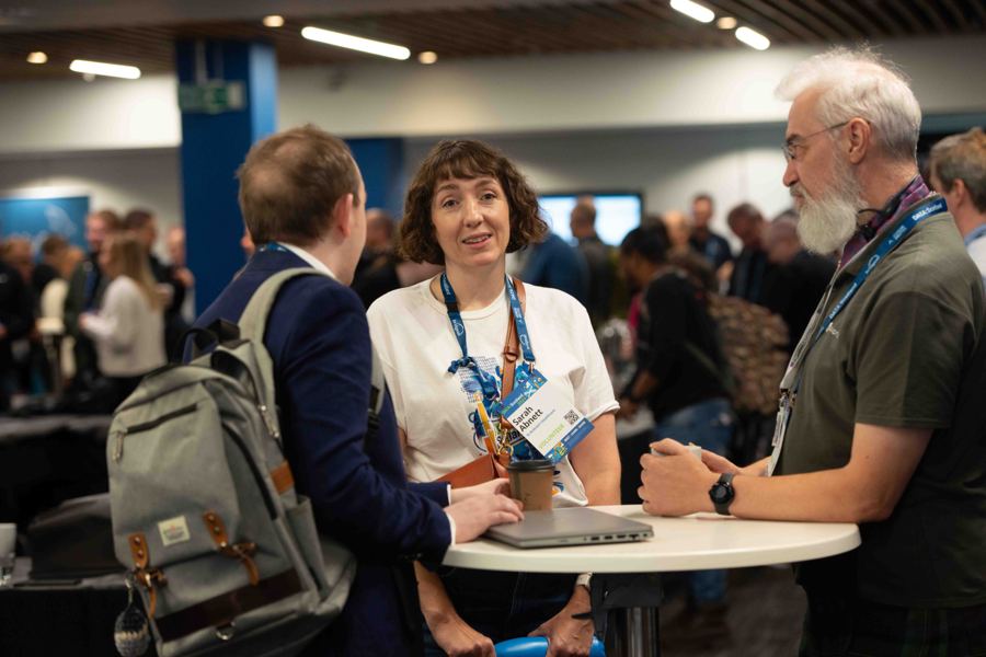 Attendees chatting between sessions in 2024