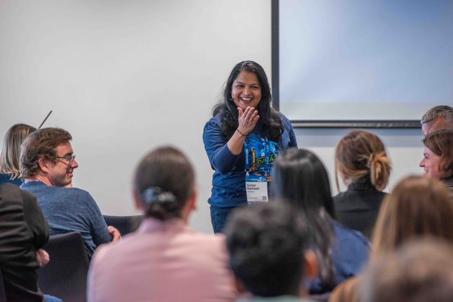 A speaker engaging with the audience in 2024